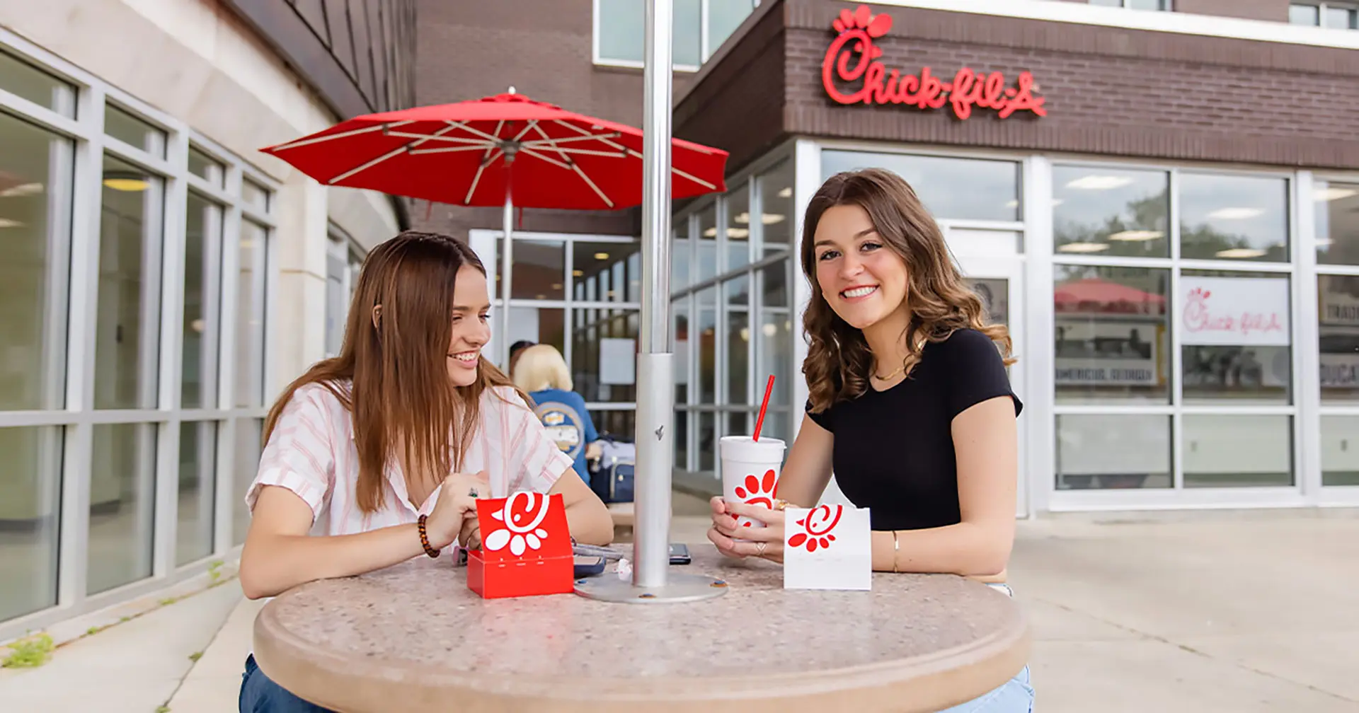 Students enjoying Chick-fil-A outside