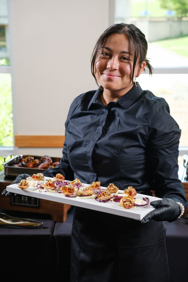 Server holding a plate or hors d’oeuvres